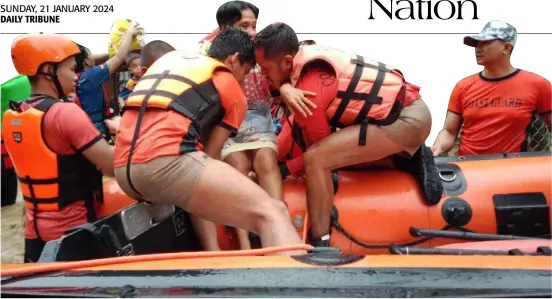  ?? PHOTOGRAPH COURTESY OF PCG ?? COAST Guard members bring residents affected by massive flooding in barangays Chicote, Poblacion, Anitap and Tibanban, Davao Oriental to higher grounds in a rescue and relief operation over the weekend.