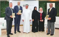  ??  ?? Abdul Rahman Mohammad Al Owais and Dr Hussain Abdul Rahman Rand and other officials during a meeting on Monday.