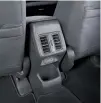  ?? ?? Rear air-conditioni­ng vents and two USB-A charging ports — not to mention a capacious cupholder — are meant to serve second-row passengers.