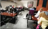  ?? ?? Election workers continue the process of counting ballots for the Pennsylvan­ia primary election on Wednesday at the Mercer County Elections Board in Mercer, Pa.
(AP/Keith Srakocic)