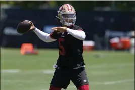  ?? JEFF CHIU — THE ASSOCIATED PRESS ?? San Francisco 49ers quarterbac­k Trey Lance takes part in drills at the team’s practice facility in Santa Clara on Tuesday.