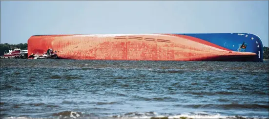  ?? SEAN RAYFORD / GETTY IMAGES ?? Cutting a large maritime vessel into pieces is often considered a last resort. It’s particular­ly tragic for the 656-foot Golden Ray (above), which has been sitting on its side in St. Simons Sound since Sept. 8, because it is a relatively new ship built in 2017.