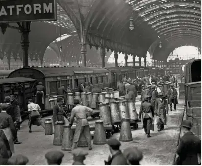  ??  ?? Volunteers help to distribute supplies of milk across the country from Paddington Station, London, during the General Strike, 1926
