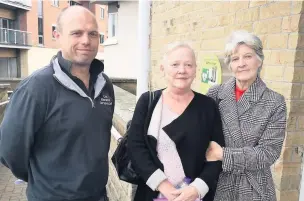  ??  ?? ● Councillor Paul Cox with campaigner­s after plans to build six assisted living flats in Accrington were unanimousl­y refused.