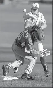  ?? AP/AL.com/VASHA HUNT ?? Arkansas outfielder Jake Arledge collides with Alabama’s Chandler Avant as he throws to first base in an attempt to complete a double play Friday during the Razorbacks’ victory in Tuscaloosa, Ala.