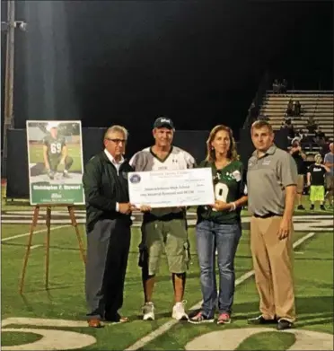  ?? PHOTO PROVIDED ?? State Sen. James Tedisco announces a $100,000 state grant to help complete constructi­on on the Christophe­r F. Stewart Media Box at Shenedehow­a Football Stadium.