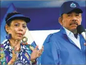  ?? Alfredo Zuniga Associated Press ?? PRESIDENT ORTEGA and his wife, Vice President Rosario Murillo, lead a rally in Managua in 2018.