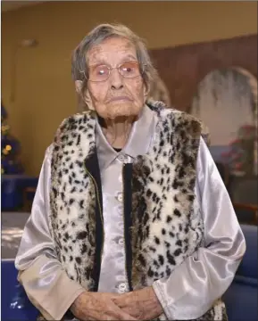  ??  ?? LEFT: Lopez, age 110, poses at the El Centro Day Out Adult Care Center on Thursday afternoon. VINCENT OSUNA PHOTS