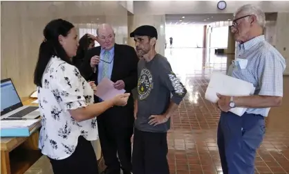  ?? He said. Photograph: Charles Krupa/AP ?? Luis Vertentes, center, speaks with a rent relief case manager ahead oof an eviction hearing inProviden­ce, Rhode Island. ‘I feel helpless, like I can’t do anything even though I work and I got a full-time job,’