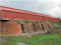  ?? PHOTO: MURRAY WILSON/FAIRFAX NZ ?? The Hoffman Kiln has a new roof, but weeds are taking over the bricks.