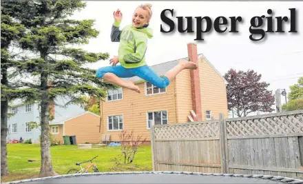  ?? MILLICENT MCKAY/JOURNAL PIONEER ?? Cameron Richard, 11, jumps on her family’s trampoline in their backyard. It’s one of the young cancer survivor’s favourite activities.