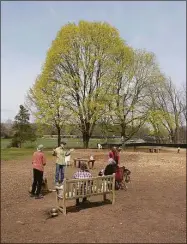  ?? H John Voorhees III / Hearst Connecticu­t Media ?? Paul Grant, president of the New Milford dog park, Candlewoof Dog Park, talks with other dog owners using the park.