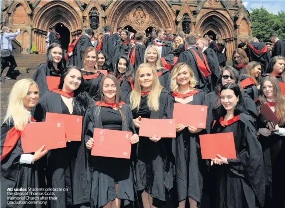  ??  ?? All smiles Students celebrate on the steps of Thomas Coats Memorial Church after their graduation ceremony