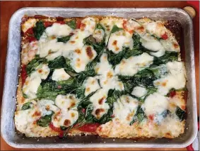  ?? ELIZABETH KARMEL ?? This Jan. 7, 2021 photo shows a sheet-pan pizza, a fun meal to make with kids.