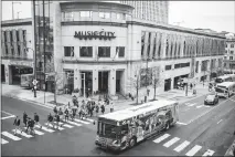  ??  ?? A bus passes Music City Center, the transporta­tion hub in downtown Nashville, Tenn.