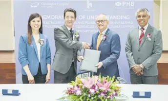  ?? ?? (From left) Gleneagles Hospital Kuala Lumpur CEO Hoo Ling Lee, Jean-François, Mohamad Damshal, and PHB Investment senior general manager Kamal Zainul at the MOU signing ceremony.