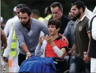  ?? AP/MARK BAKER ?? Zaed Mustafa, 13, attends the burial of his father, Khalid Mustafa, and brother Hamza, 15, at a cemetery Wednesday in Christchur­ch, New Zealand. Zaed suffered arm and leg wounds when a gunman opened fire at their mosque.