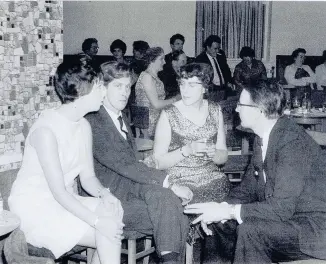  ??  ?? Pictured is Mr Michael J Hallam, managing director of County Knitwear in Shepshed (on the left) at the firms Christmas Party at the Shepshed Labour Club with his wife sat next to him, thought to have been taken in 1966-67.