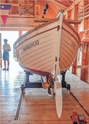  ?? ?? The restored 1931 Coast Guard Surf Boat in the Lifesaving Station Museum was not used in Marblehead, but it represents boats that once saved lives off the Marblehead coast. It is one of many artifacts featured in the ODNR Cardinal Collection.