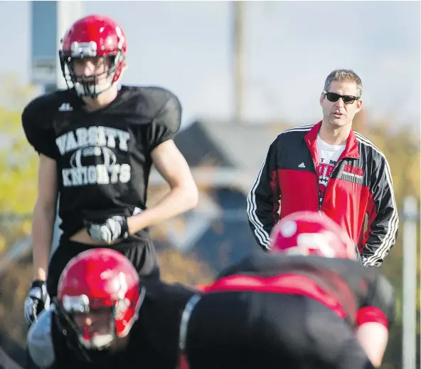  ?? GERRY KAHRMANN/PNG ?? STEVE EWEN St. Thomas More Knights football head coach Steve De Lazzari watches his team practise at Byrne Creek secondary school in New Westminste­r on Wednesday.