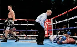  ?? Photo: ACTION IMAGES/ANDREW COULDRIDGE ?? CONCLUSIVE: Groves is wiped out by fierce rival Froch in their rematch