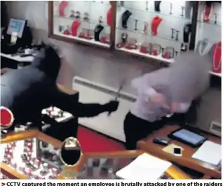  ??  ?? > CCTV captured the moment an employee is brutally attacked by one of the raiders