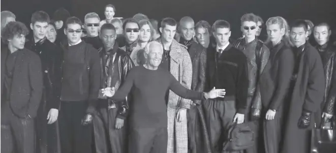  ?? AP ?? DESIGNER Giorgio Armani (center) accepts applause at the conclusion of the Emporio Armani men’s Fall-winter 2020/21 collection, that was presented in Milan, Italy, in January 2019.