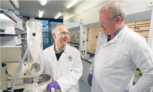  ?? Picture: Alan Richardson. ?? Professor Ian Gilbert, left, and Dr Kevin Read at work in Dundee University, which has been hailed as the most influentia­l in the world for its scientific research.