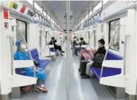  ?? — Reuters ?? Passengers ride on a Metro Line 3 train yesterday, the first day when parts of the city’s subway services resumed.