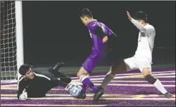  ?? DAVID WITTE/NEWS-SENTINEL ?? Davis goalkeeper Diego Sedillo controls a ricochet in front of Tokay's Jordan Baumback and Davis defender Benjamin Park.