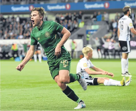  ?? Picture: SNS Group. ?? James Forrest turns away to celebrate after netting Celtic’s winner in Trondheim last night.