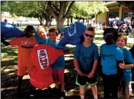  ?? COURTESY PHOTOGRAPH ?? Amare, Silas, Nick, Michael, Sasha and Luke, students at Lodi SDA Elementary, stop to snap a quick picture at the fair.