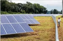  ?? BOB ANDRES/BANDRES@AJC.COM ?? Solar power panels are being added throughout Georgia, as electricit­y providers diversify energy sources. Natural gas has been the biggest fuel for power generation.