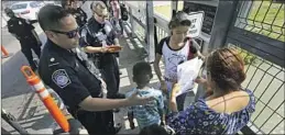  ?? Marco Ugarte Associated Press ?? A U.S. CUSTOMS and Border Protection officer checks documents in 2019.