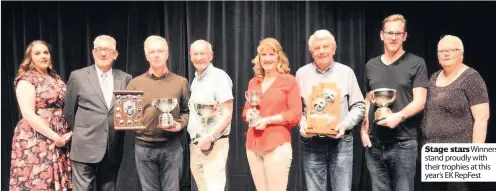  ??  ?? Stage starsWinne­rs stand proudly with their trophies at this year’s EK RepFest