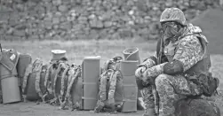  ?? SCOTT HEPPELL/AP ?? A Ukrainian soldier trains in northern England Thursday. Ukraine asked the EU to draft its anti-war resolution in consultati­on with U.N. member states, seeking strong support from the internatio­nal community.