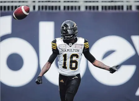 ?? COLE BURSTON THE CANADIAN PRESS ?? Hamilton Tiger-Cats wide receiver Brandon Banks flicks a ball as he celebrates one of his two touchdowns, and fourth in two games, over the Toronto Argonauts on Saturday at BMO Field.