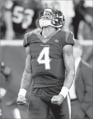  ?? CHRISTIAN PETERSEN/GETTY ?? Deshaun Watson celebrates after completing a 34-yard pass to set up the Texans’ game-winning field goal.