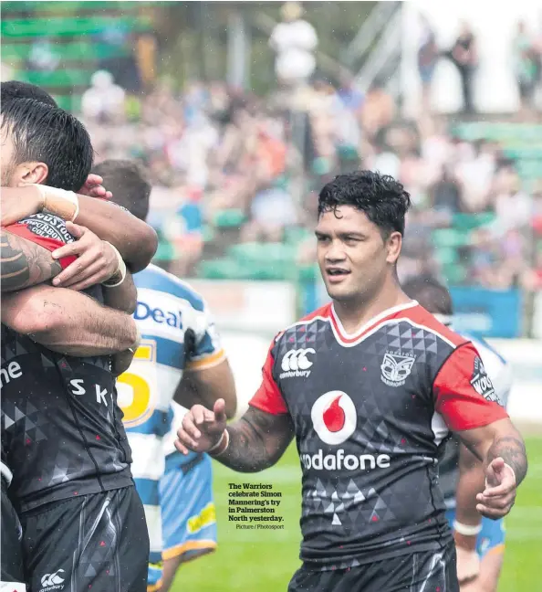  ?? Picture / Photosport ?? The Warriors celebrate Simon Mannering's try in Palmerston North yesterday.