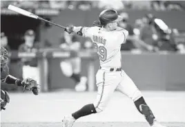  ?? MARK BLINCH/GETTY ?? Orioles’ Ramón Urías hits a two-run double against the Blue Jays in the sixth inning at the Rogers Centre Tuesday in Toronto.