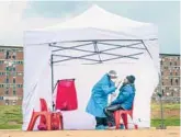  ?? JEROME DELAY/AP ?? A resident gets tested for COVID-19 in Johannesbu­rg on April 29, 2020. A new coronaviru­s variant has been detected in South Africa.