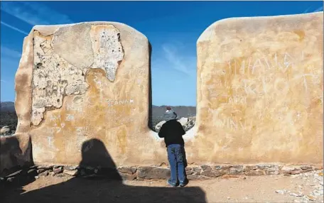  ?? Photograph­s by Irfan Khan
Los Angeles Times ?? AUSTIN SERAFIN,
5, of San Diego explores historic structural remains at Joshua Tree’s Ryan Ranch that have been defaced.