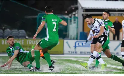  ?? STEPHEN MCCARTHY/SPORTSFILE ?? Robbie Benson scores for Dundalk in their rout over Limerick at Oriel Park last night
