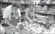  ?? File photo ?? Volunteers pick and bag food during a previous Shepherd’s Food Pantry day at Bella Vista Lutheran Church, 1990 Forest Hills Blvd. The Shepherd’s Food Pantry is open Jan. 4 from 10 a.m. until noon. A container for donations is in the church narthex, and pie filling and cereal are needed. So far this year, the food pantry has helped more than 5,000 people. Informatio­n: 855-0272, bvlutheran.com.