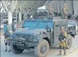  ?? HT FILE ?? CISF personnel stand guard by an armoured vehicle at the Indira Gandhi Internatio­nal Airport in New Delhi.