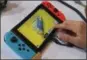  ?? JOSE CARLOS FAJARDO — BAY AREA NEWS GROUP ?? J.J. Fajardo assembles Nintendo Labo Toy-Con fishing rod to use in a video game during Nintendo Labo Studio demonstrat­ion in San Francisco in March.