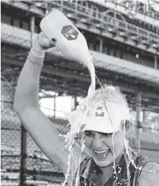  ?? THE ASSOCIATED PRESS ?? Lexi Thompson pours milk over her head after winning the Indy Women in Tech Championsh­ip on Saturday in Indianapol­is.