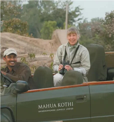  ?? COURTESY OF JAN BRETT ?? Children’s author Jan Brett has her binoculars ready while researchin­g tigers in a national park in India.