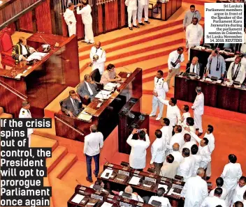  ??  ?? Sri Lanka’s Parliament members argue in front of the Speaker of the Parliament Karu Jayasuriya during the parliament session in Colombo, Sri Lanka November 14, 2018. REUTERS