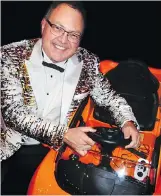  ??  ?? New Car Dealers Associatio­n of B.C. president and CEO Blair Qualey out-glittered car show vehicles in a jacket that fetched $800 at charity auction.